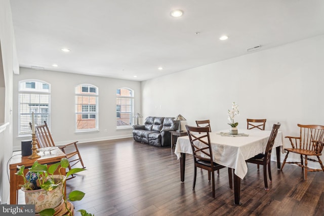 dining area with dark wood finished floors, recessed lighting, and visible vents