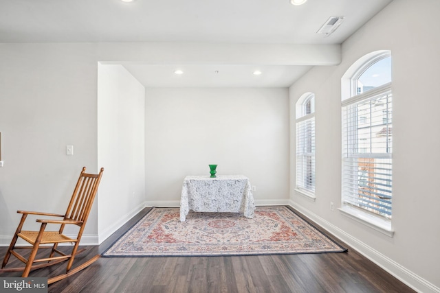 living area featuring visible vents, recessed lighting, wood finished floors, and baseboards