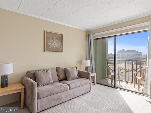 carpeted living room featuring crown molding