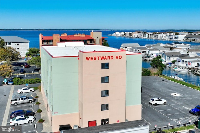 birds eye view of property with a water view