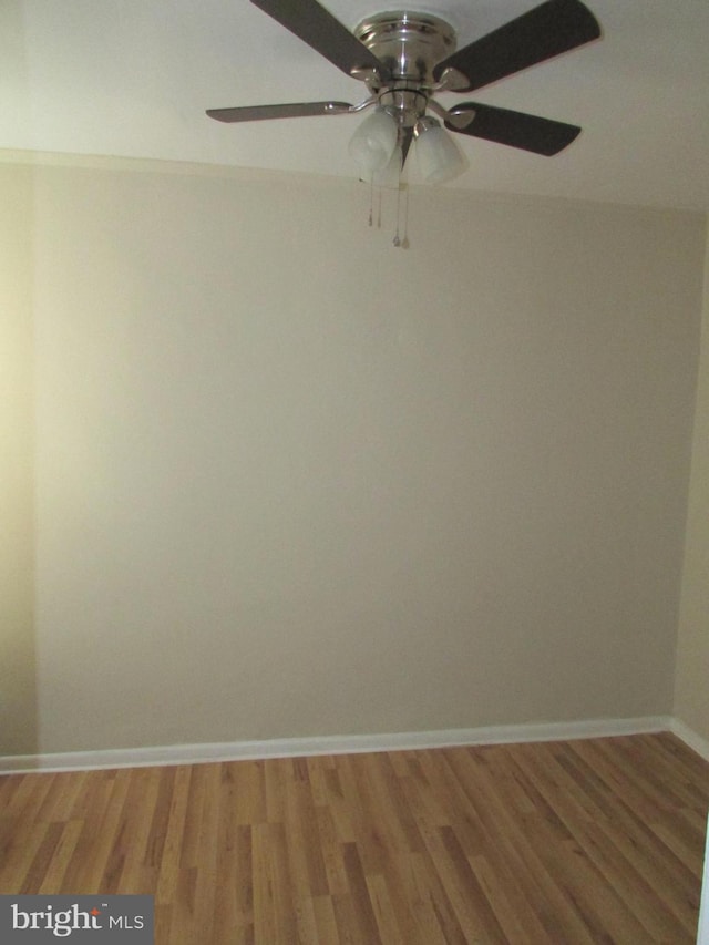 unfurnished room with hardwood / wood-style floors