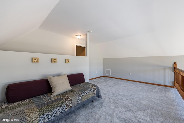 living area with vaulted ceiling and carpet flooring