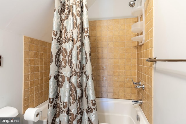 bathroom featuring shower / tub combo with curtain