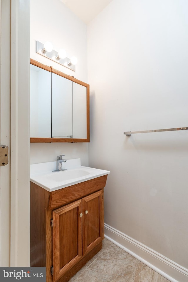 bathroom with vanity and tile patterned flooring