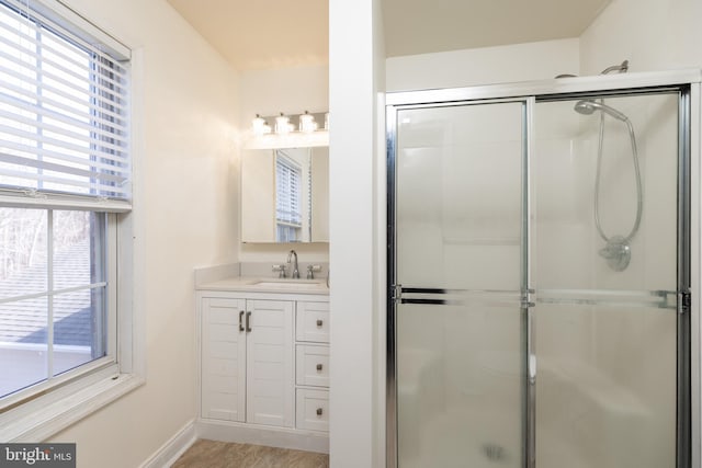 bathroom with vanity and an enclosed shower