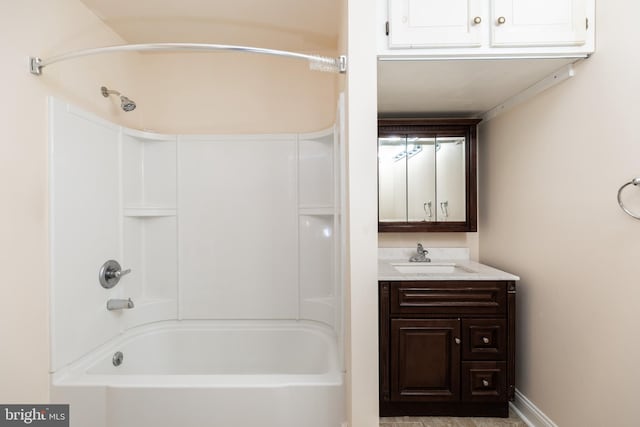 bathroom with washtub / shower combination and vanity