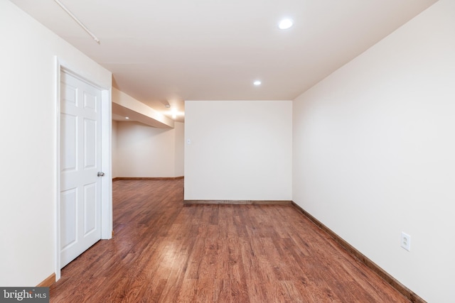 spare room featuring dark hardwood / wood-style flooring