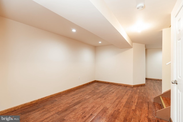 basement featuring hardwood / wood-style floors