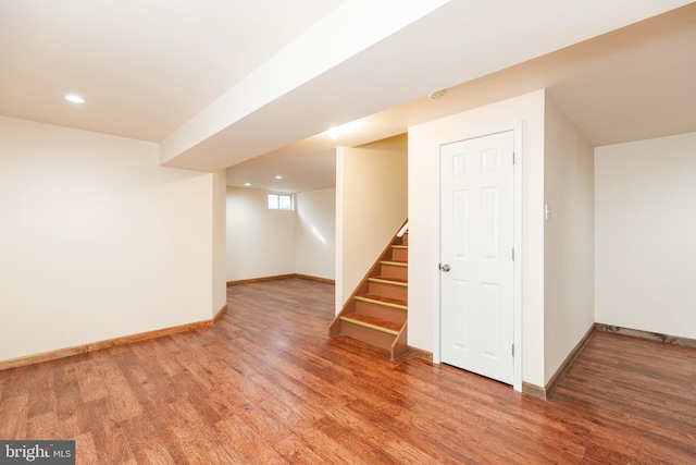 basement with hardwood / wood-style flooring