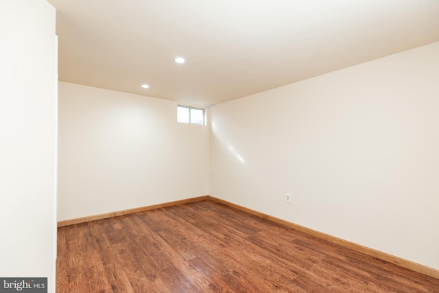 spare room with hardwood / wood-style flooring