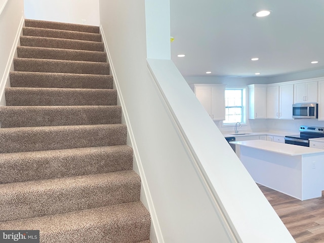 106 Thyme Way, Bunker Hill, WV 25413 - stairs featuring wood finished floors and recessed lighting