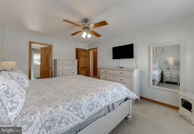 bedroom with baseboards, a ceiling fan, and light colored carpet