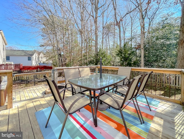 deck featuring outdoor dining area