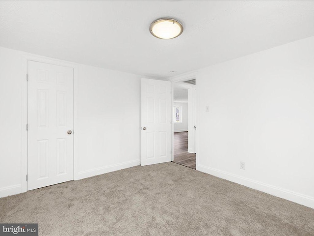 unfurnished bedroom featuring carpet