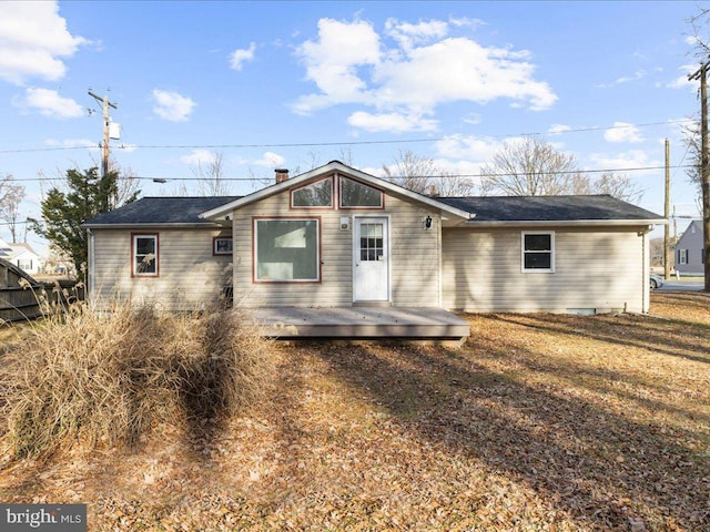 back of house featuring a wooden deck