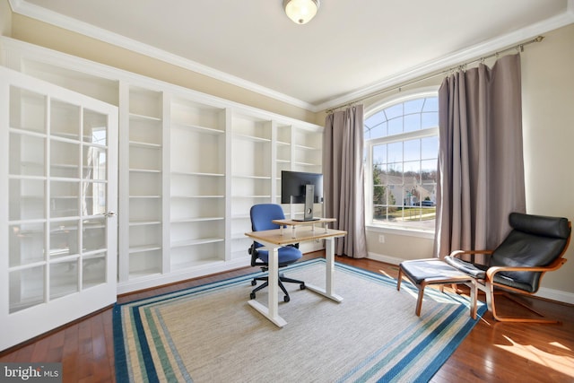 office area with crown molding, baseboards, and wood-type flooring