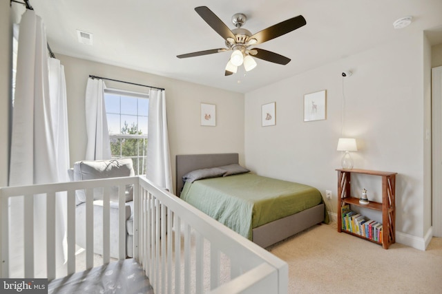 bedroom featuring baseboards, visible vents, carpet floors, and ceiling fan