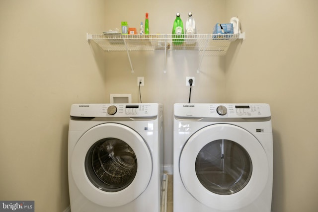 clothes washing area with laundry area and washing machine and dryer