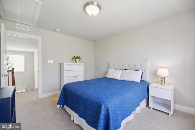 bedroom with light carpet, visible vents, attic access, and baseboards