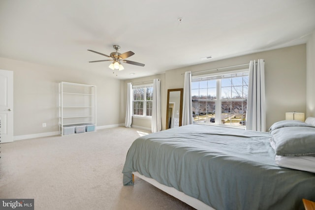 bedroom with baseboards, carpet floors, visible vents, and ceiling fan