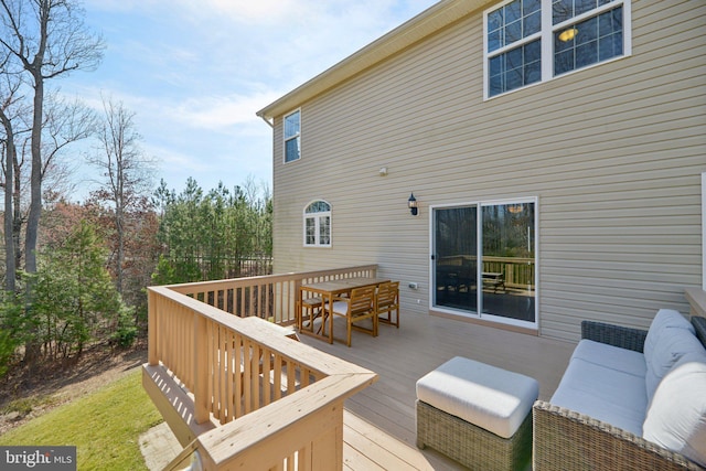 wooden terrace featuring outdoor dining space