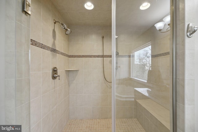 bathroom featuring recessed lighting and a stall shower