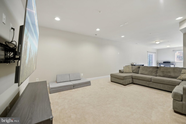 living room with recessed lighting, baseboards, and carpet floors