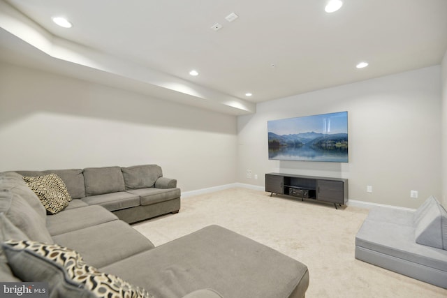 carpeted living room featuring recessed lighting and baseboards