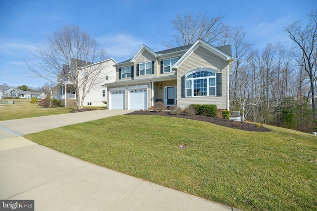 traditional-style home featuring a front yard, an attached garage, and driveway