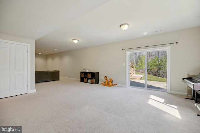 recreation room featuring carpet and baseboards