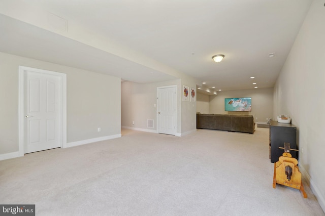 interior space with recessed lighting, visible vents, carpet floors, and baseboards