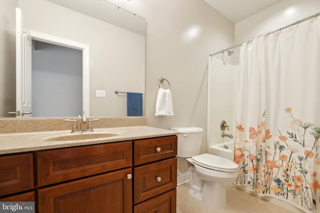 full bathroom with tile patterned flooring, toilet, vanity, and shower / bath combo