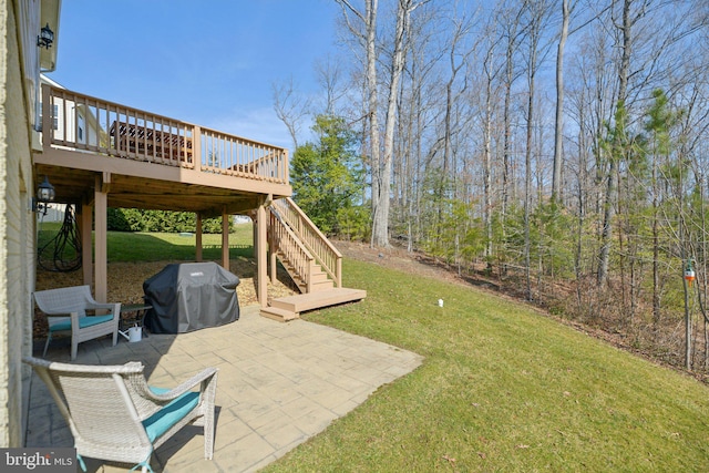 view of yard with stairway, a patio area, and a wooden deck