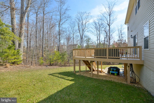 view of yard featuring a wooden deck