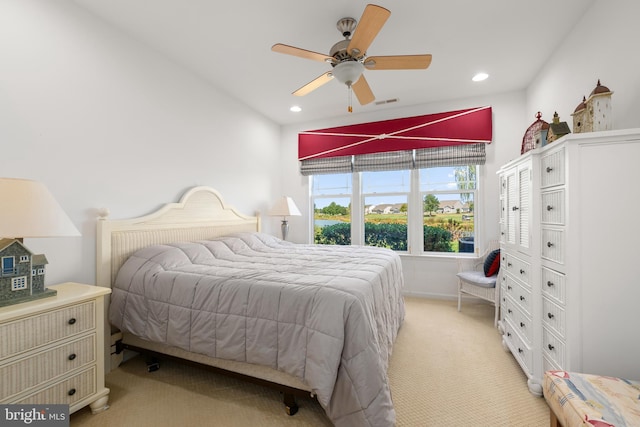 carpeted bedroom featuring ceiling fan