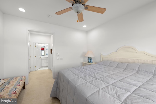 bedroom with light carpet and ceiling fan