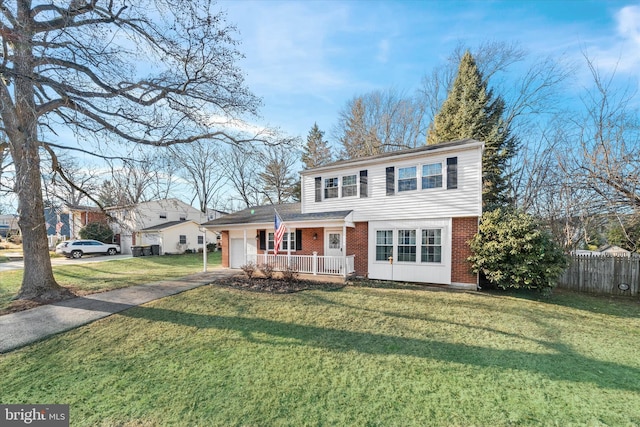 view of front property featuring a porch and a front lawn