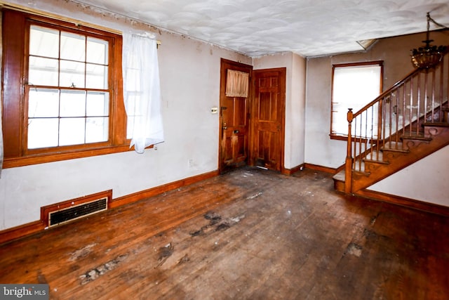 unfurnished room with dark hardwood / wood-style floors