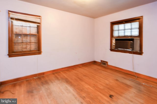 unfurnished room featuring hardwood / wood-style floors