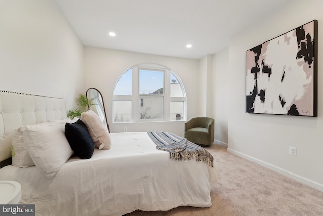 bedroom featuring light carpet