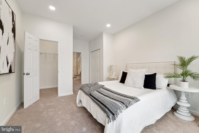 bedroom featuring light carpet