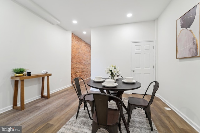 dining area featuring dark wood-type flooring