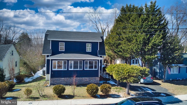 view of front of home featuring a shingled roof