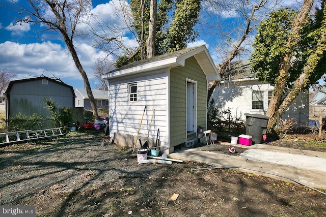 view of shed with fence