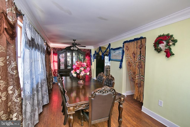 dining space with baseboards, wood finished floors, a ceiling fan, and crown molding