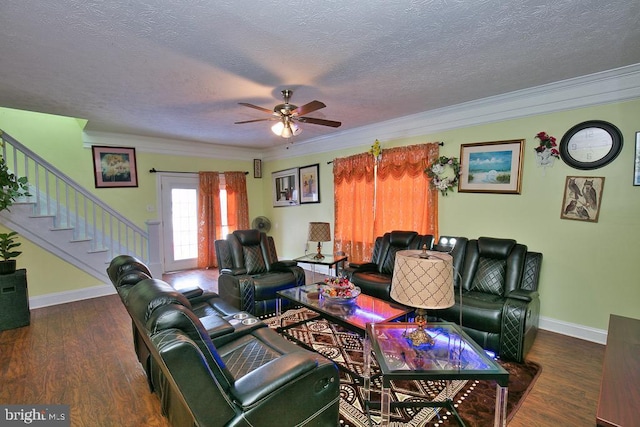 living area featuring ornamental molding, stairway, baseboards, and wood finished floors