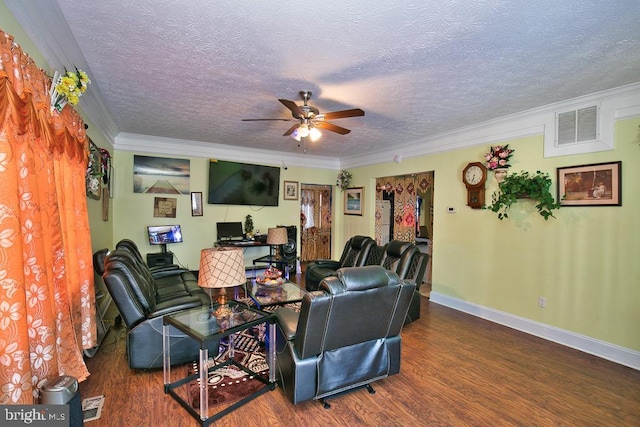 living area featuring crown molding, visible vents, a ceiling fan, wood finished floors, and baseboards