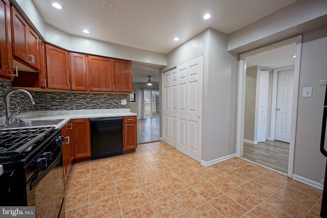 kitchen with sink, tasteful backsplash, light tile patterned floors, ceiling fan, and black appliances