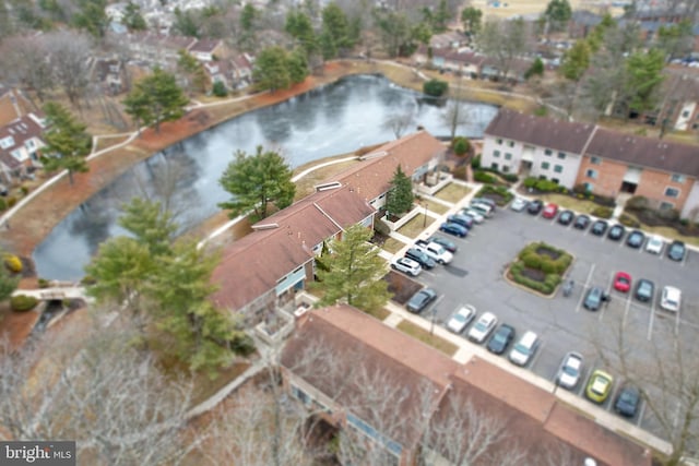 birds eye view of property featuring a water view