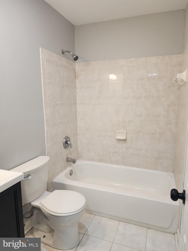 full bathroom with vanity, toilet, tile patterned floors, and tiled shower / bath